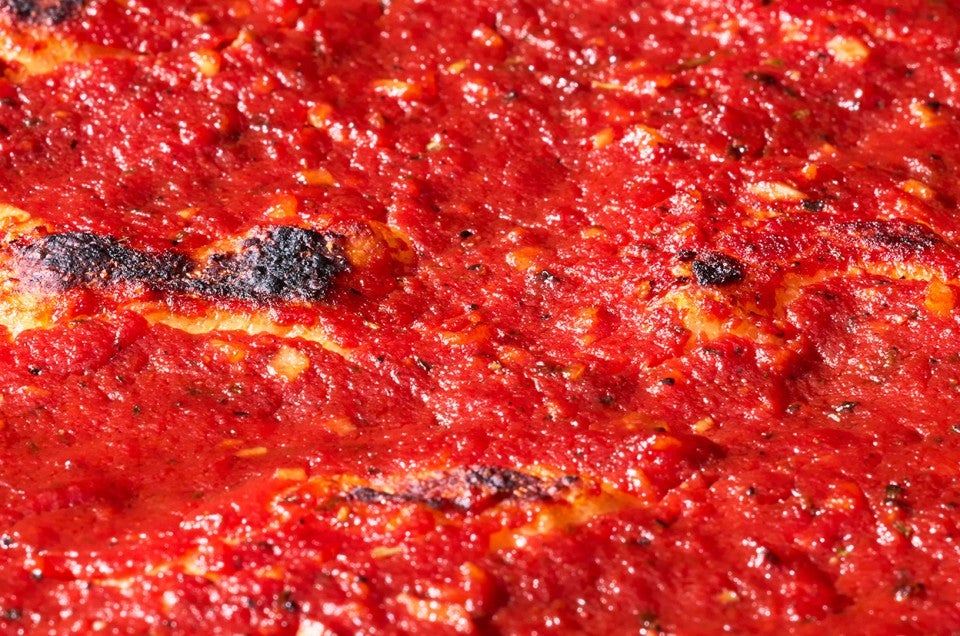 Detail shot of tomato topping on Rhode Island Pizza Strip. - select to zoom