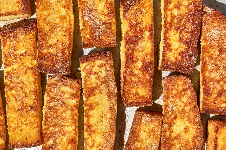 French Toast Sticks laid out on a counter seen from above. - select to zoom