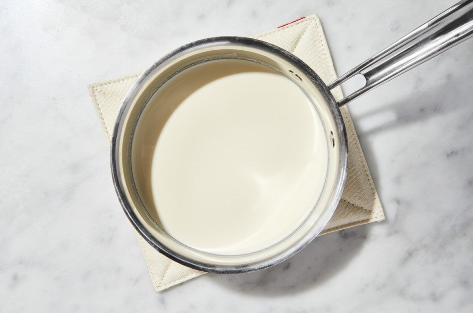 Heavy cream in a saucepan