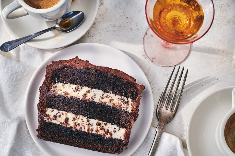 A slice of chocolate cassata cake with layers of chocolate and creamy filling. - select to zoom