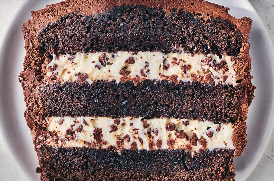 A slice of chocolate cassata cake with layers of chocolate and creamy filling. - select to zoom