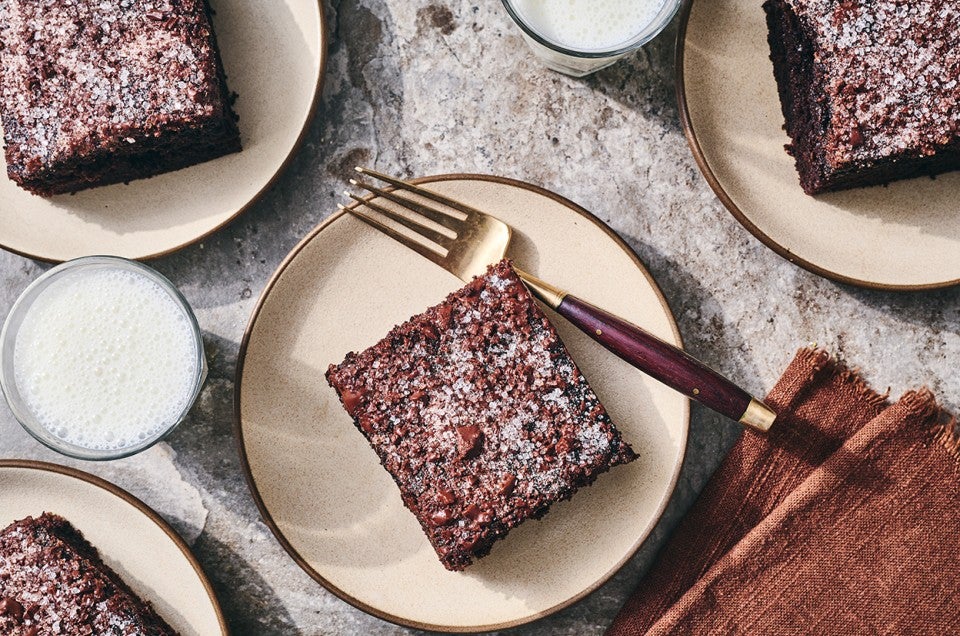 Chocolate Olive Oil Cake on a plate. - select to zoom