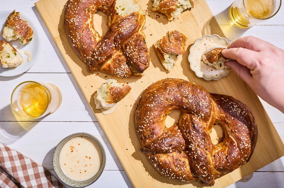 Giant Jalapeño Pretzels served on a cutting board - select to zoom