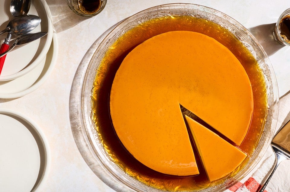 Flan seen from above with a single slice in the bottom right corner. - select to zoom
