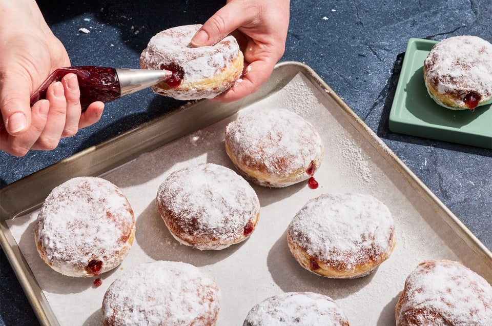 A Pączki (Polish Doughnut) being filled - select to zoom