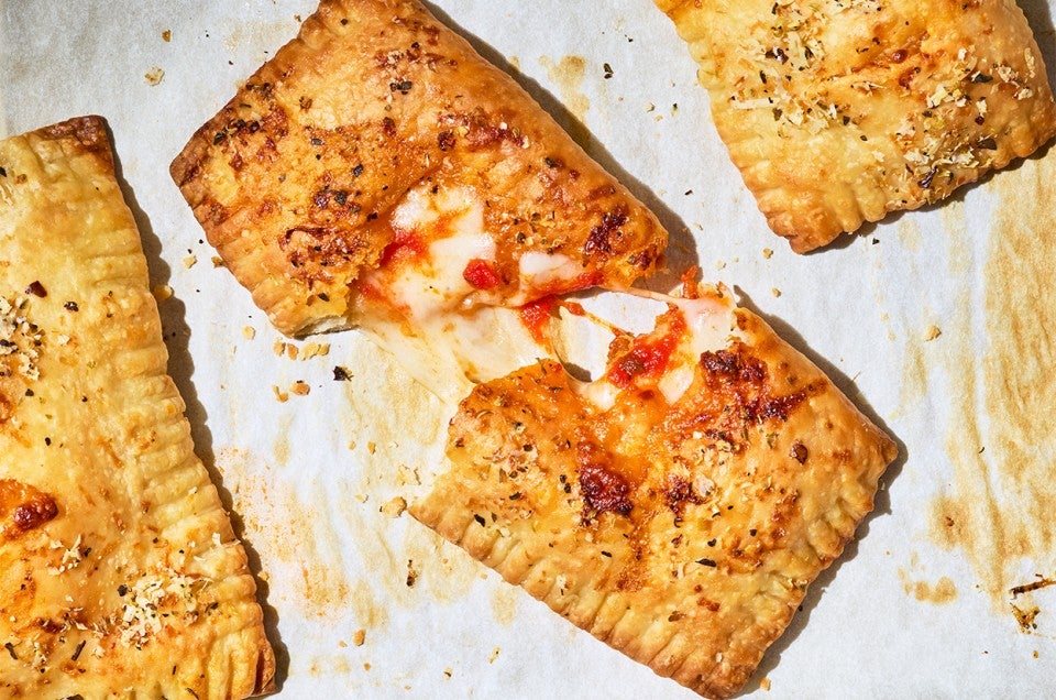 A Homemade Pizza Pocket broken in half showing the interior - select to zoom