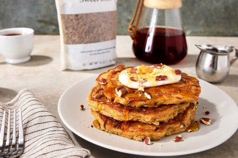 Carrot Cake Pancakes on a plate topped with nuts - select to zoom