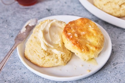 3-Ingredient Buttermilk Biscuits on a plate with butter - select to zoom