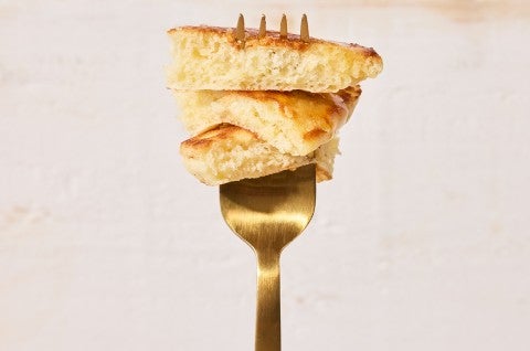 Easy Buttermilk Pancakes stacked up on a fork - select to zoom
