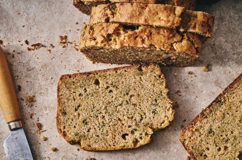Almond Flour Zucchini Bread sliced on parchment - select to zoom