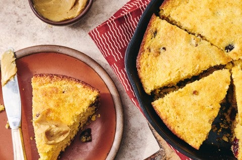 Cranberry Cornbread sliced and in a cast iron pan - select to zoom