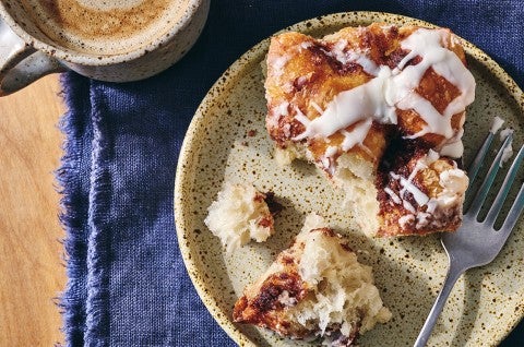 Cinnamon Roll Focaccia broken up on a plate - select to zoom