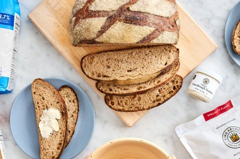 Classic Miche sliced on a cutting board - select to zoom
