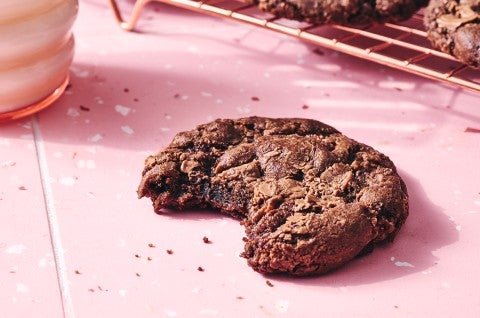A single Chocolate Sourdough Discard Cookie with a bite taken out - select to zoom