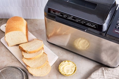 Bread Machine Sourdough Bread next to a bread machine - select to zoom