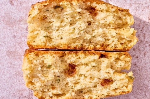 Brown Butter Sage Biscuit broken in half to show interior crumb - select to zoom