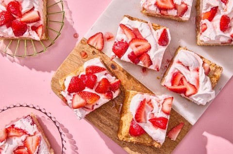 Giant Strawberry Shortcake sliced on a cutting board - select to zoom