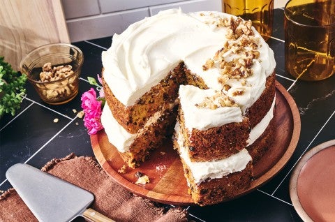 Gluten-Free Carrot Cake with Cream Cheese Frosting with a slice cut out - select to zoom