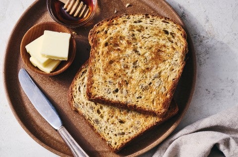 Kansas Sunflower Bread toasted with butter and honey - select to zoom