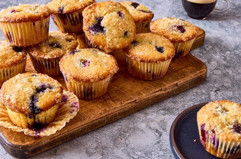 Lemon Blueberry Muffins on a cutting board - select to zoom