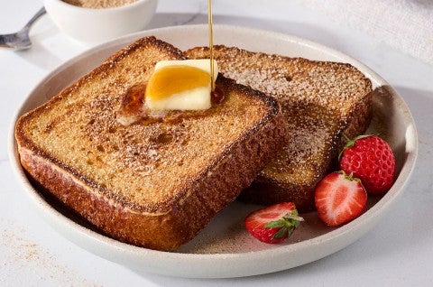 Brioche French Toast on a plate with butter and maple syrup - select to zoom