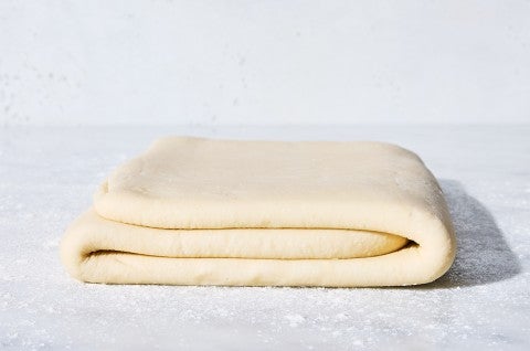 Dough for Classic Puff Pastry (Pâte Feuilletée) on a table - select to zoom