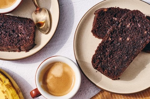 Double Chocolate Banana Bread on a plate with some coffee - select to zoom