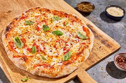 No-Knead Pizza Crust on a cutting board - select to zoom