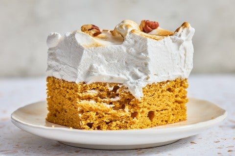A slice of Sweet Potato Cake with Marshmallow Frosting on a plate - select to zoom
