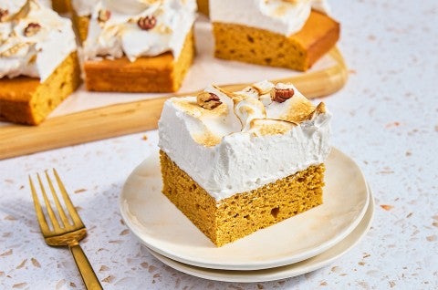 A slice of Sweet Potato Sheet Cake with Marshmallow Frosting on a plate - select to zoom