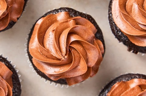 Chocolate Buttercream frosting piped onto chocolate cupcakes - select to zoom