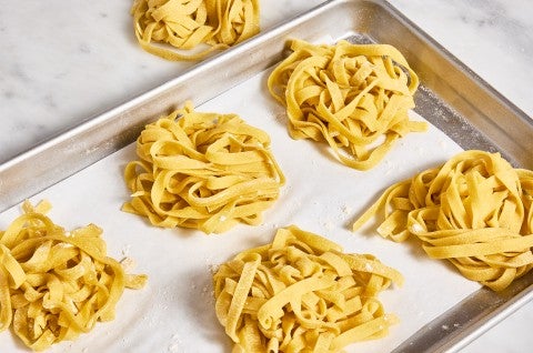 Homemade Pasta in nests on a sheet pan - select to zoom