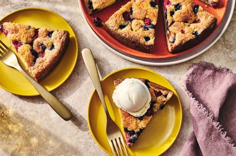 Slices of Late Summer Berry Torte on plates with a scoop of vanilla ice cream - select to zoom