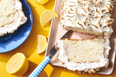 Lemon Angel Food Cake with Meringue Topping sliced on a serving tray - select to zoom