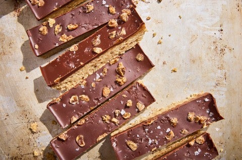 No-Bake Chocolate and Date Energy Bars on parchment paper - select to zoom