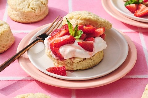 Self-Rising Cream Biscuits made into a shortcake topped with strawberries and whipped cream - select to zoom