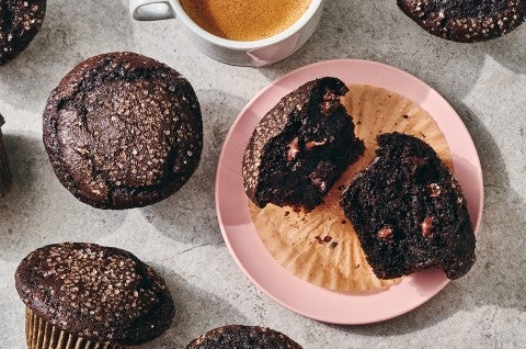 A Chocolate Breakfast Muffin broken open on a plate