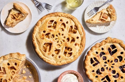 Double-crusted pies with pie designs in cut into the tops
