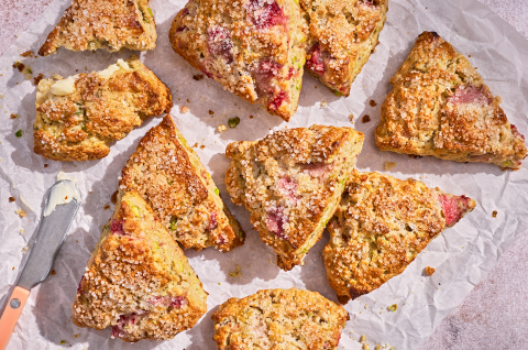 10 Roasted Strawberry and Pistachio Scones on a baking sheet looking at the top - select to zoom