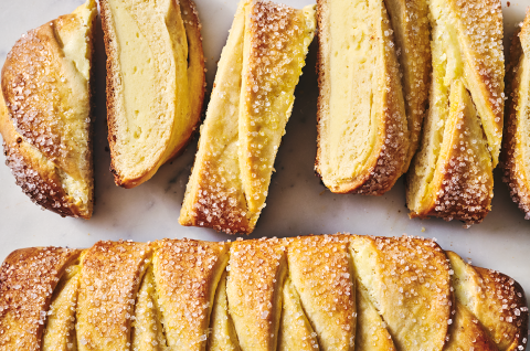 Cheese Filled Sweet Braid shown on a counter from above both sliced, and as a whole loaf. - select to zoom