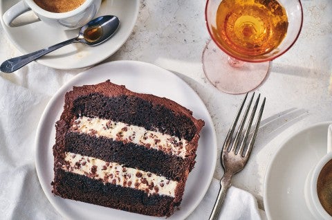 A slice of chocolate cassata cake with layers of chocolate and creamy filling. - select to zoom