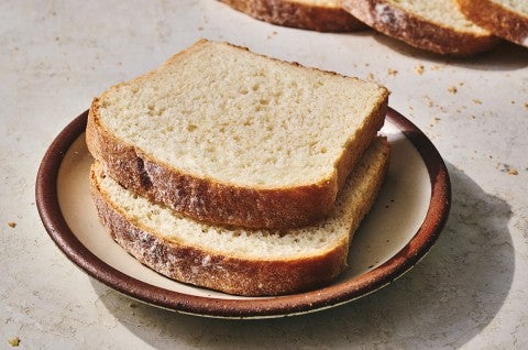 Two slices of classic sandwich bread on a plate. - select to zoom
