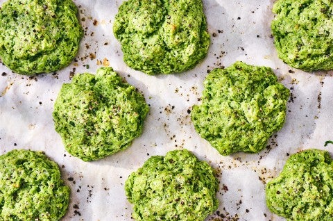 Green Goddess Herb Biscuits fresh out of the oven on parchment paper. - select to zoom