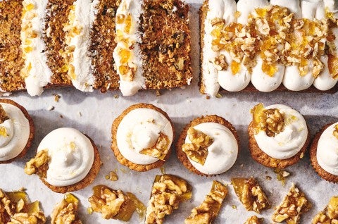 Spiced Carrot Snacking Cake shown as a sliced cake as well as cupcakes. - select to zoom