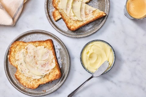 Slices of toast spread with cultured butter
