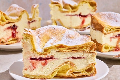 Karpatka Cake on plates showing the layers of cake and filling. - select to zoom