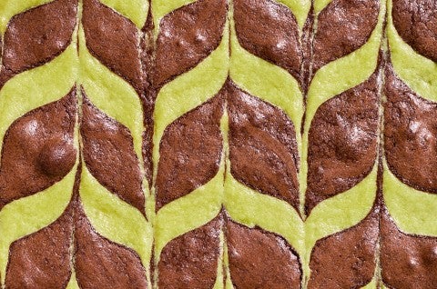 Detailed overhead shot of mint brownies showing a minty feathered pattern. - select to zoom