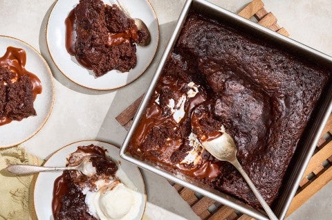 Sourdough Discard Chocolate Pudding Cake in a baking pan and on plates seen from above. - select to zoom