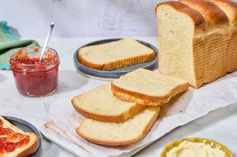 Sourdough Milk Bread sliced an arranged on a counter - select to zoom