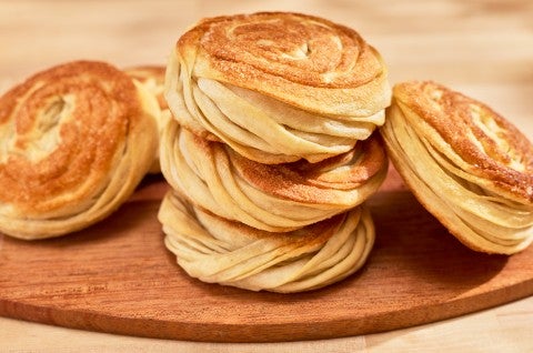 Thousand Layer Mo stacked on a wooden plate. - select to zoom